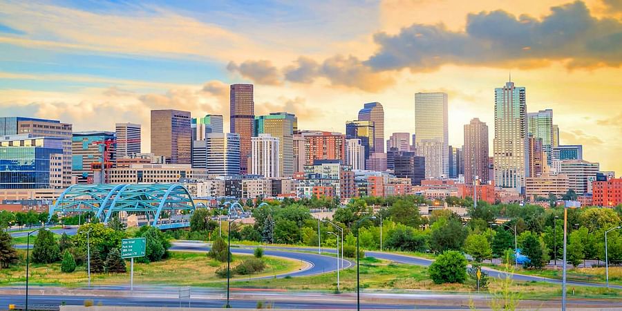 Denver skyline with a serene spa zen garden in the foreground