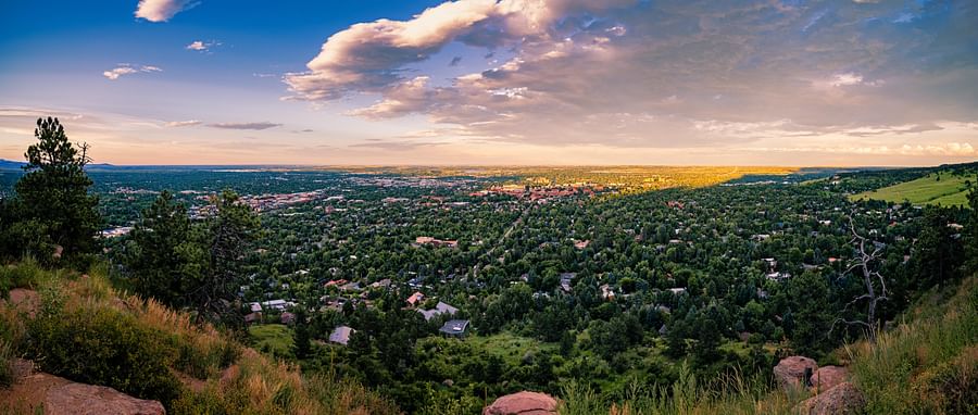 Panoramic view of Boulder, Colorado with a backdrop of the Rocky Mountains